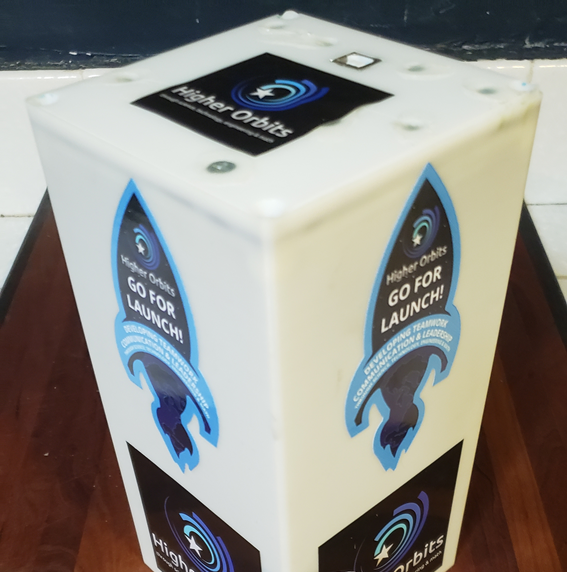Higher Orbits payload enclosure with mission stickers